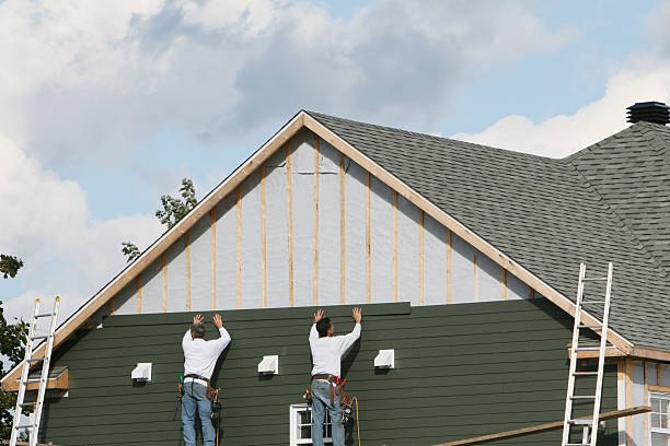 Professional Storm Damage Siding Repair technician working in West Chicago, IL